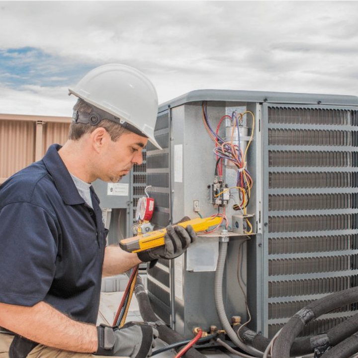 Komoka Heating & Cooling HVAC technician on a service call in Komoka, Ontario
